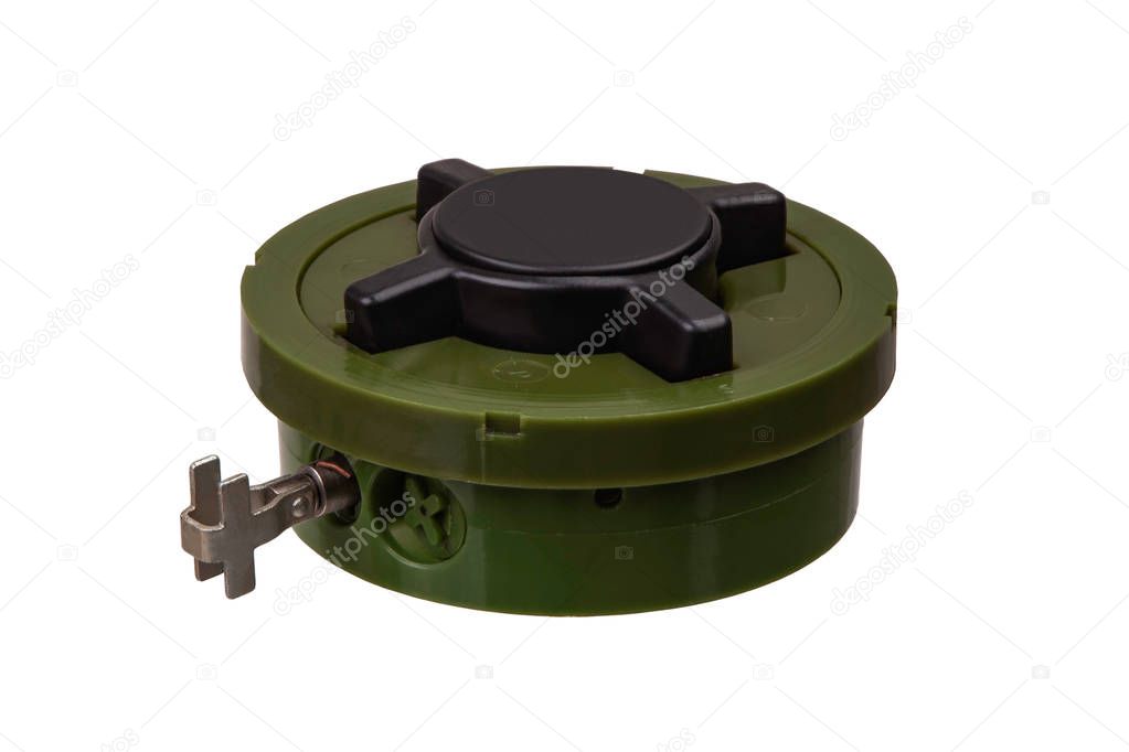 anti-personnel mine explosive device isolated on white.  land mine is an explosive device concealed under or on the ground and designed to destroy or disable enemy targets.