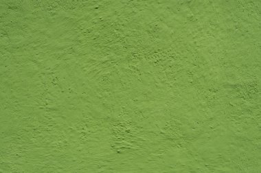 Duvar yeşille boyanmış. Parlak yeşil grungy arka plan.