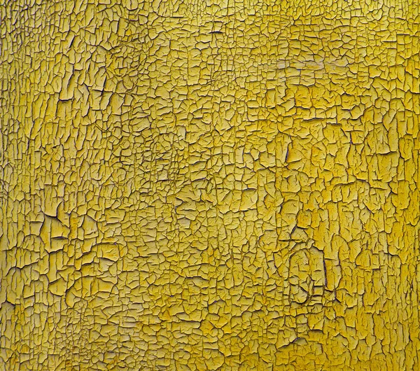 Vintage trä gul bakgrund. Sprucken gul färg på trä — Stockfoto