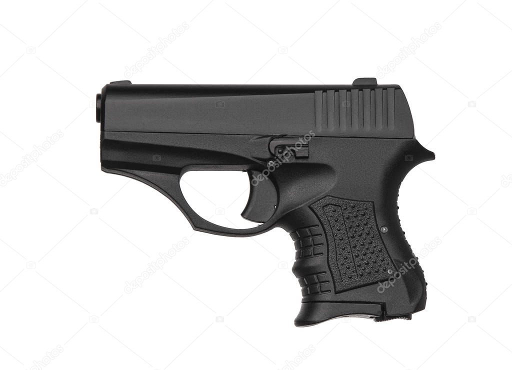 A small black modern pistol for concealed carrying isolate on a 