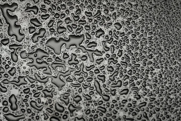 Shiny water drops on a dark glass. Water drops on black surface. — Stock Photo, Image