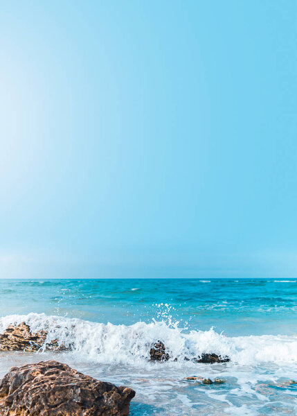 Soft wave crashing stone at bay. Stones by the sea. Sea wave bre