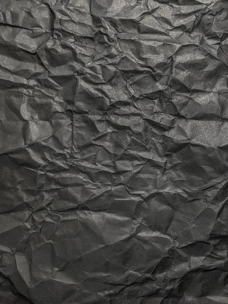 Textur av svart skrynkliga papper. Mörk pappers bakgrund med Chao — Stockfoto