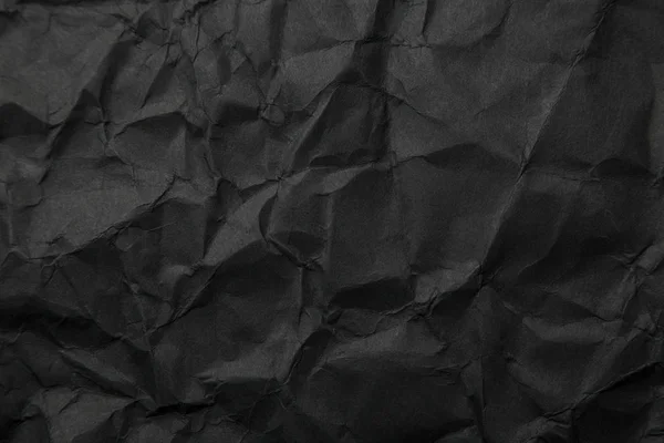 Texture of black crumpled paper. Dark paper background with chao — Stock Photo, Image