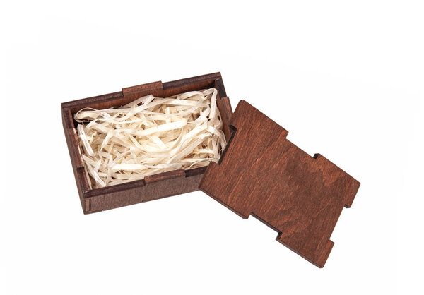 Open wooden box with filling material inside. Empty natural wood