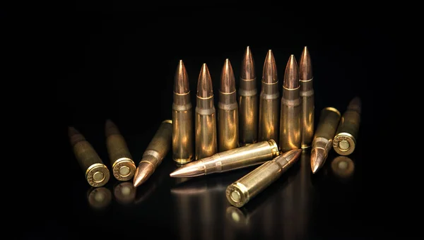 Bullet isolated on black background with reflexion. Rifle bullet — Stock Photo, Image