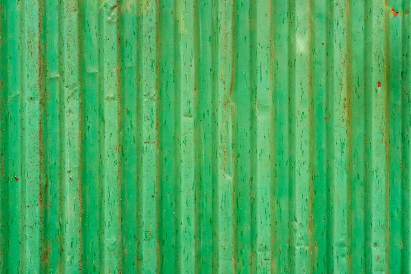 Green corrugated shipping container back. Old shipping container