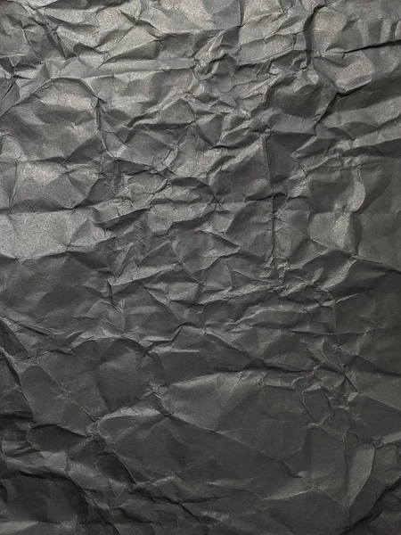 Texture di carta sgualcita nera. sfondo di carta scura con chao — Foto Stock