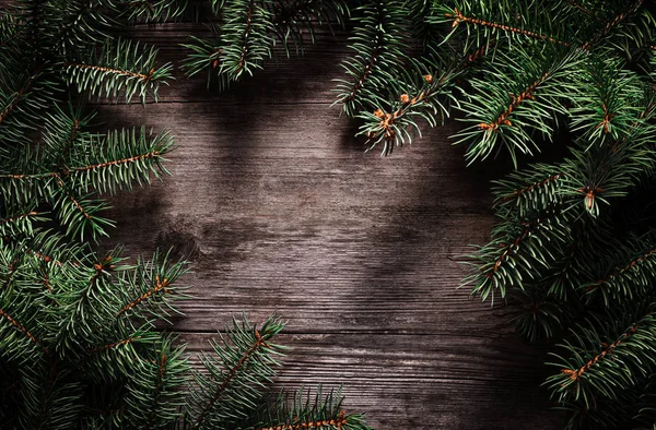 Boże Narodzenie Zielona ramka z gałęzi jodły na rocznika szarej planszy — Zdjęcie stockowe