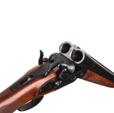 Classic double-barrell smooth-bore hunting rifle isolated on white background. Weapons for sport and hunting. Wooden butt gun.