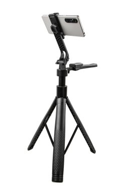 A selfie stick with a phone mounted on its tripod.