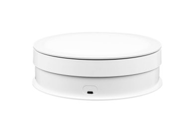 A white motorized turntable with a micro-USB port.