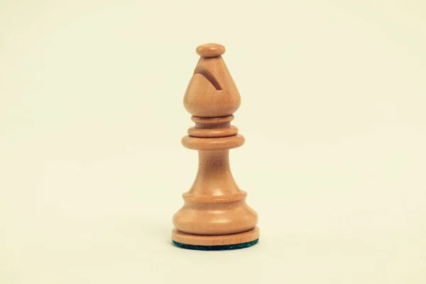 white chess bishop on white background