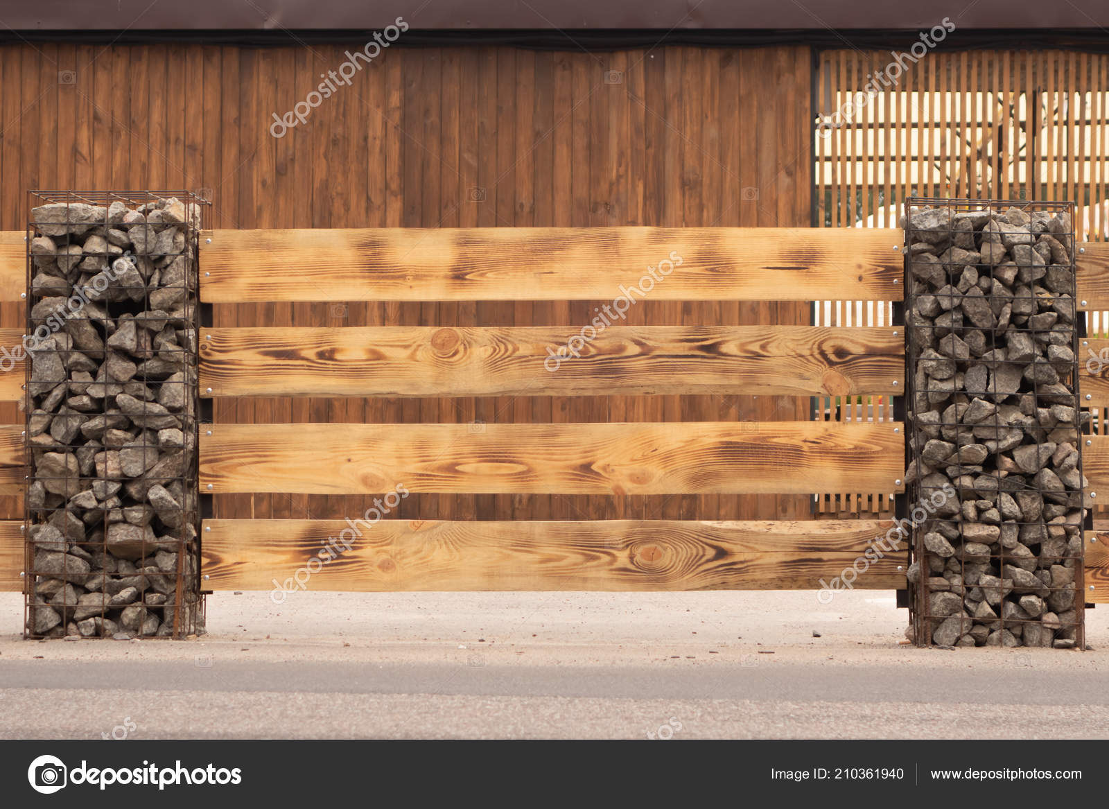 Wooden Fence Made Horizontal Boards Stone Pillars Pillars Made Metal Stock  Photo By ©Vk1971 210361940