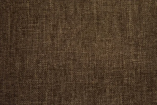 Gray linen textile seamless natural background. Fabric with smooth surface and matte gloss. Cloth smooth-haired, thick coarse scrim, sailcloth, canvas, tarpaulin. Textured weaving simple material