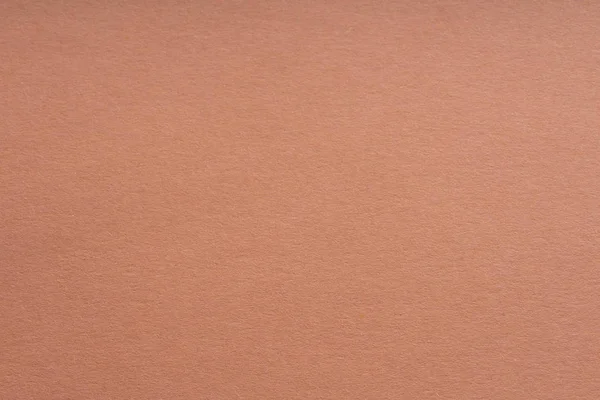 Kağıt arka plan gri-pembe renk. Kaba kağıt dokusu. Closeup. Makro.
