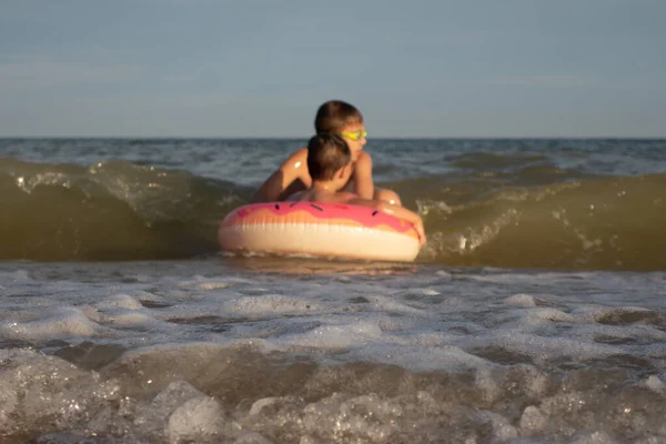 Year Old Boy Swims Sea Donut Shaped Inflatable Circle His — Stock Photo, Image