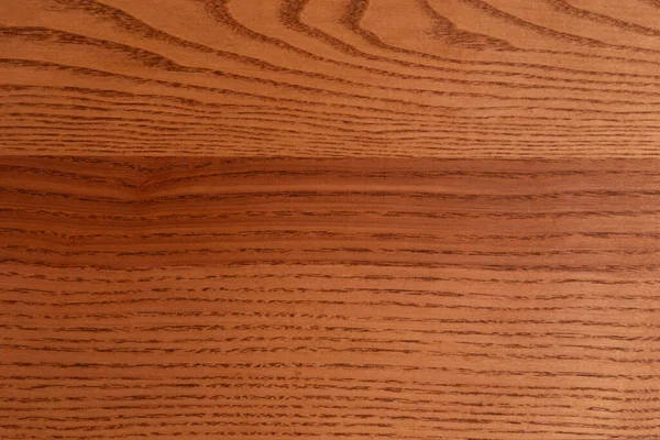 The structure of natural ash wood, tinted oak. Hardwood. Creative vintage background. Imitation of aging