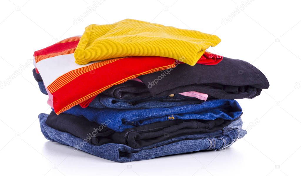 Pile of colorful clothes, isolated white background