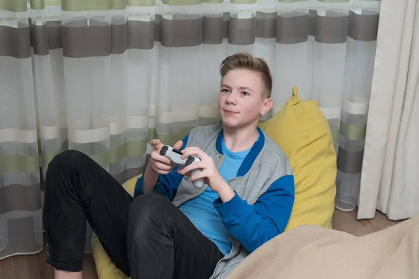 Teenager playing video games at home. gaming game play tv fun ga