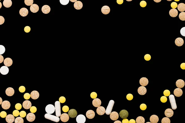 Assorted pharmaceutical medicine pills, tablets and capsules on black background. Creative idea. Drugs. Sad. Die. Illness. — Stock Photo, Image