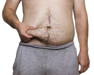 Adam beyaz arka plan üzerinde yağ karnına dokunmak