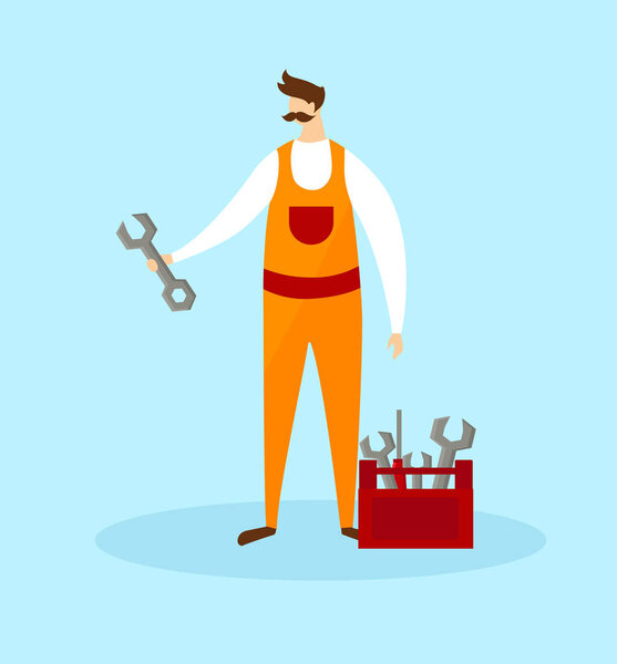 Mechanic in Orange Overalls Holding Wrench in Hand