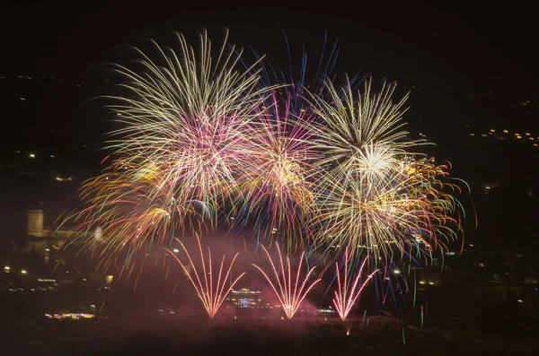 Celebrations in the city with fireworks that color the night sky