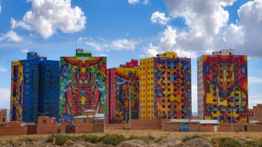 The colorful towers of Condominio Wiphala, painted by Bolivian artist Roberto Mamani Mamani in El Alto, La Paz clipart