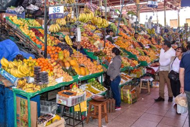 Arequipa, Peru - October 7, 2018: Fresh fruit and vegetable produce on sale in the central market, Mercado San Camilo clipart