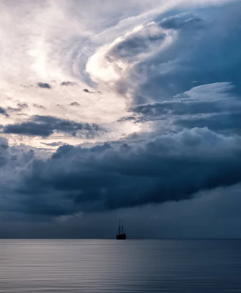 Storm Clouds Ship Stock Photo