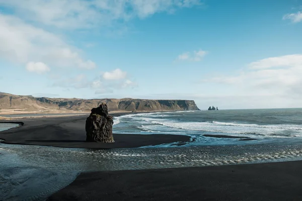 Black rocky beach with huge waves in Vik i Myrdal, Iceland