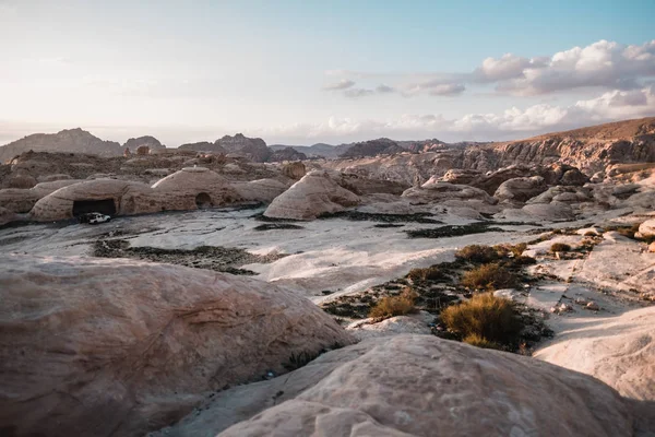 Rocks and barren landscape with stony caves in desert of Jordan, Asia