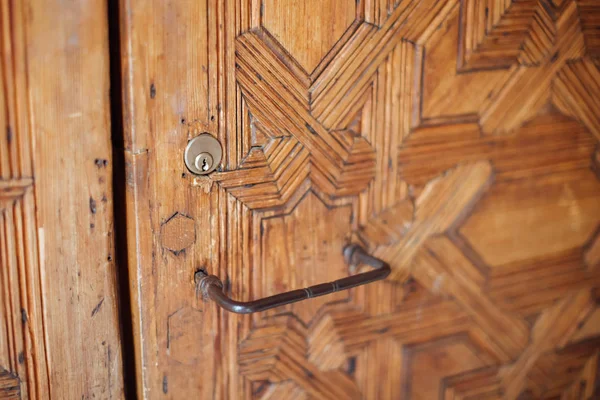 Ancient carved door in Arabian castle in Spain.