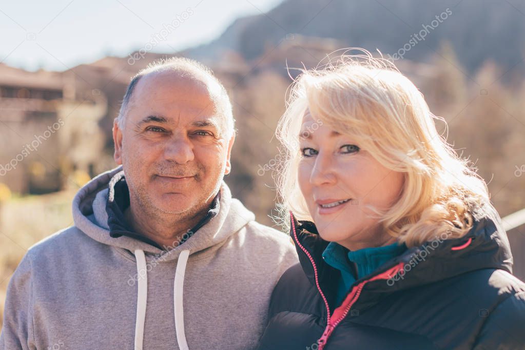 Portrait of sporty senior multiracial couple looking to the camera