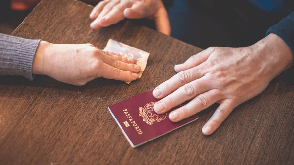 Male Female Hands Table Exchange Italian Passport Money Concept Illegal — Stock Photo, Image