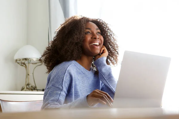 Portrait Smiling Young Woman Sitting Home Laptop Looking Away — Stock Photo, Image