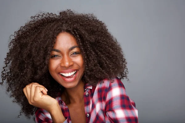 Portrait Cheerful Young African American Woman Curly Hair Laughing Gray — Stock Photo, Image