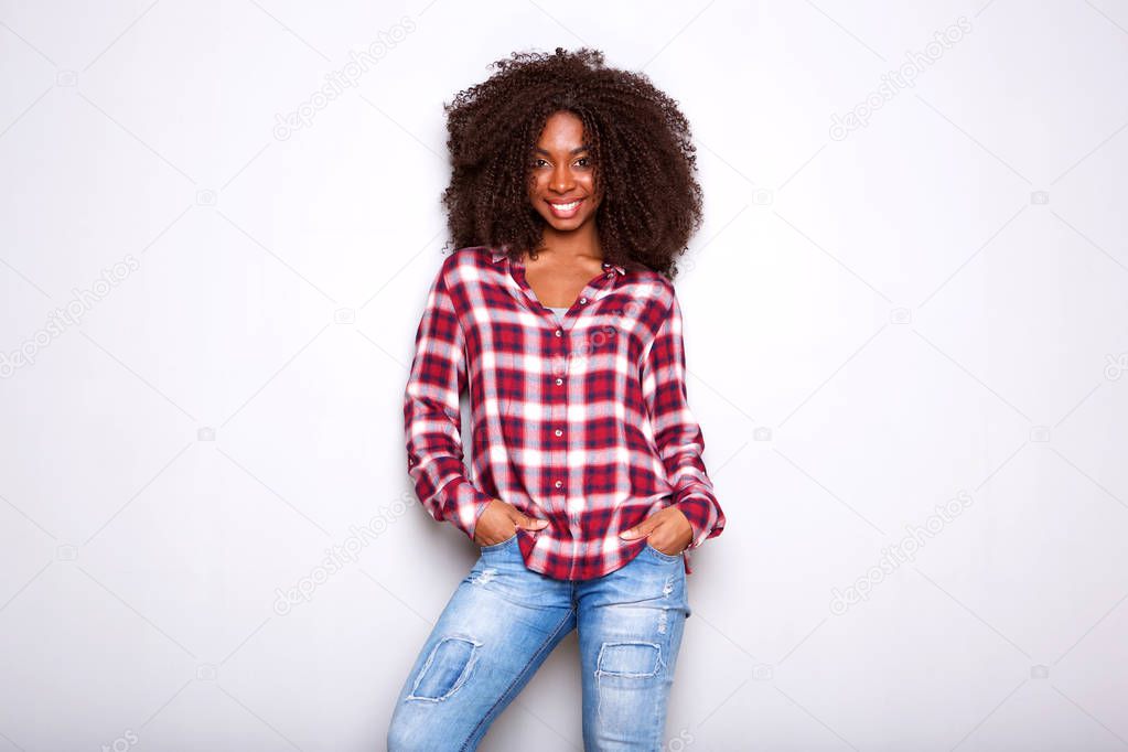 Portrait of fashionable young african american woman posing on white background