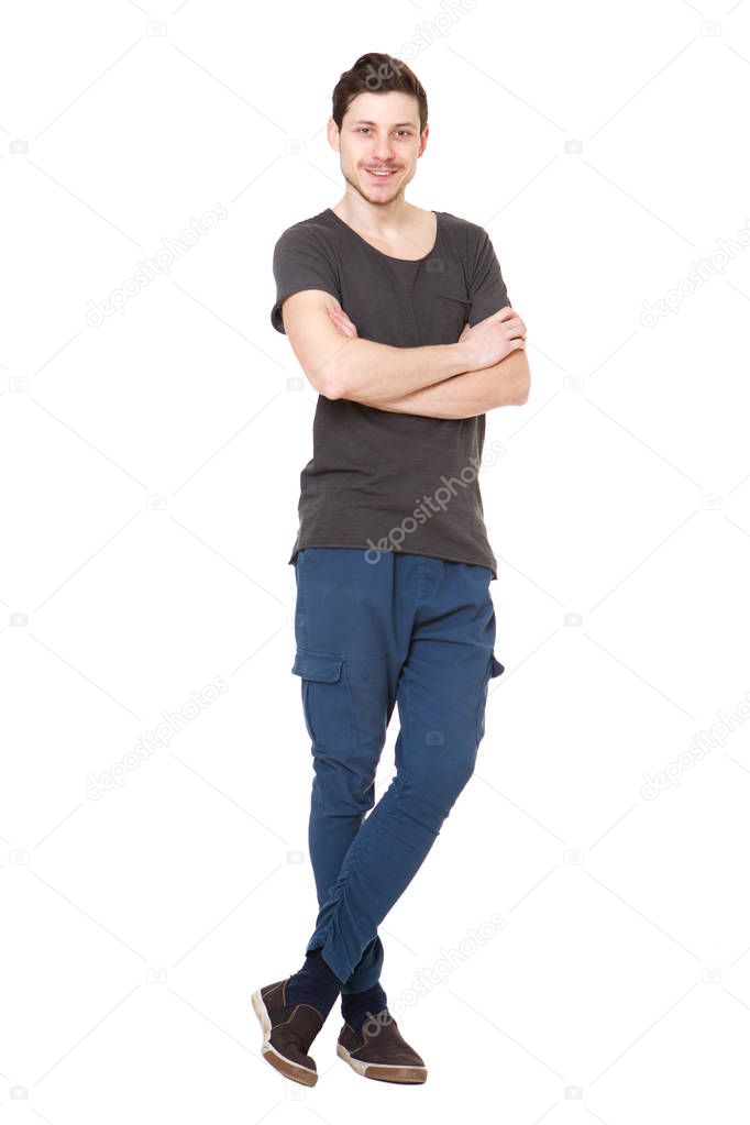 Full body portrait of cool young man against isolated white background