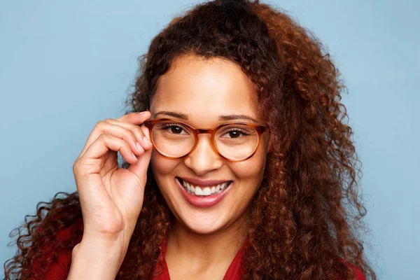 Close Portrait Woman Glasses Curly Hair Smiling Blue Background — Stock Photo, Image