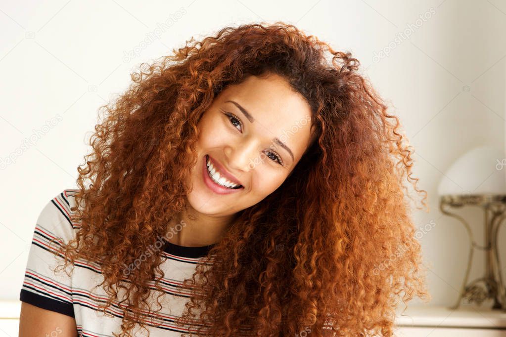 Close up portrait of happy young african american woman smiling 