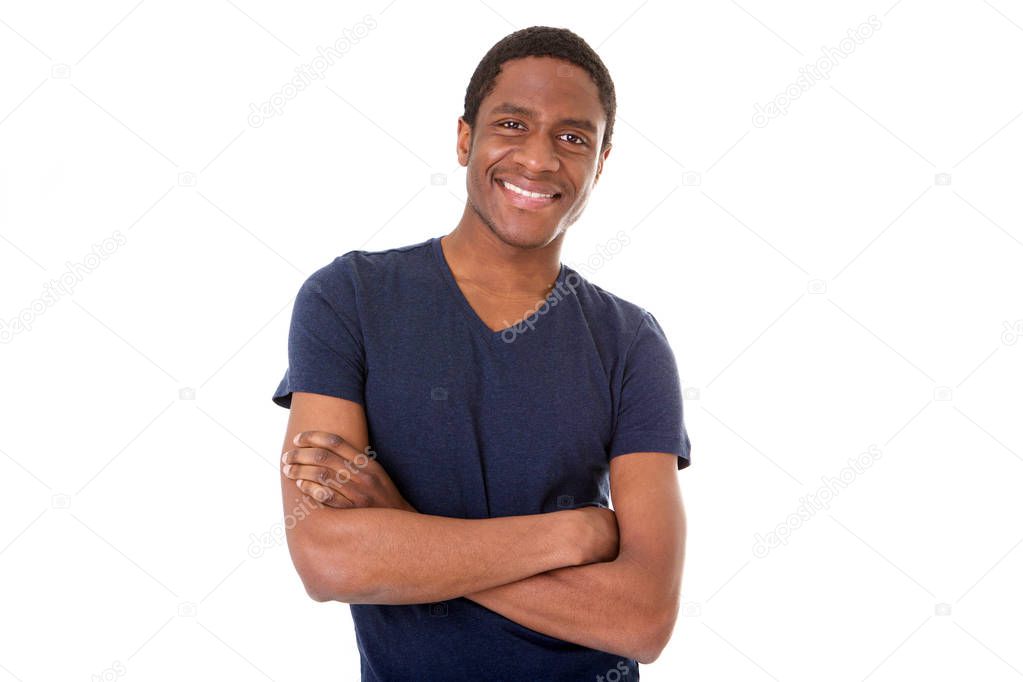 Portrait of happy black man smiling with arms crossed against isolated white background