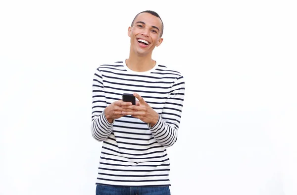 Portret Szczęśliwy Młody Człowiek Śmiejąc Się Telefonu Komórkowego Białym Tle — Zdjęcie stockowe
