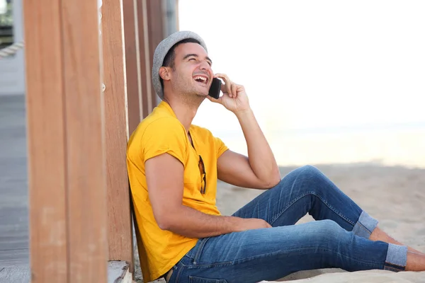 Side Portrait Happy Man Sitting Sand Beach Talking Mobile Phone — Stock Photo, Image