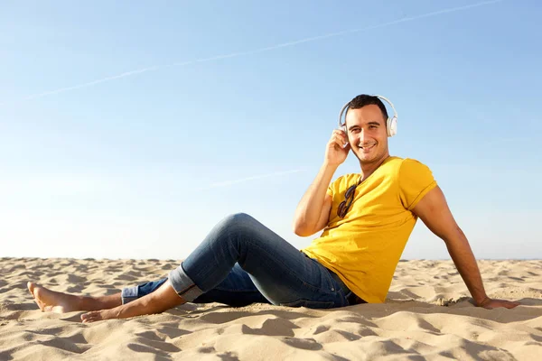 Portrait Barefoot Smiling Man Sitting Sand Beach Listening Music Headphones — Stock Photo, Image