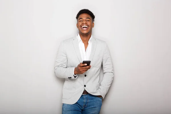 Portrait Young African American Businessman Laughing Cellphone Gray Wall — ストック写真