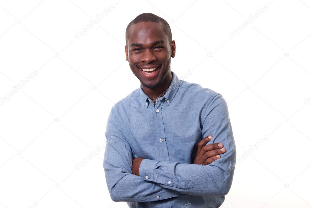 Portrait of happy young african businessman laughing against isolated white background