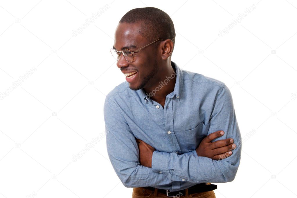 Portrait young african american businessman with glasses laughing with arms crossed against isolated white background