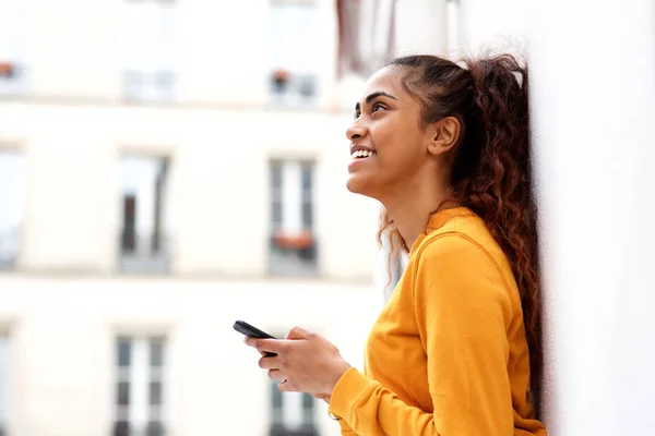 Side Portrait Happy Young Indian Woman Leaning White Wall Holding — Stock Photo, Image